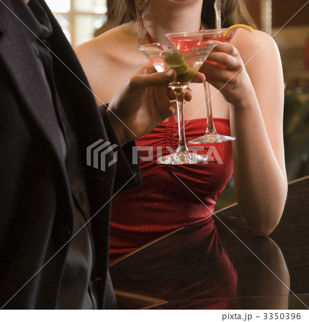 Couple with martinis. Couple with martinis. 3350396