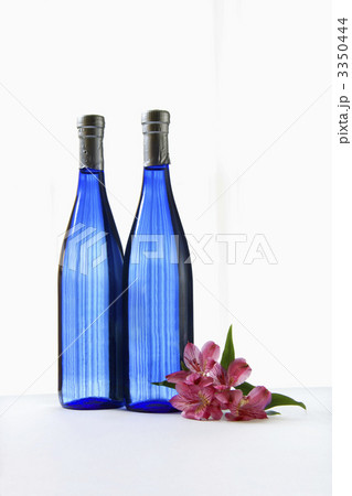 Blue bottles with flower. 3350444