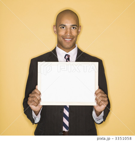 Businessman holding blank sign. Businessman holding blank sign. 3351058