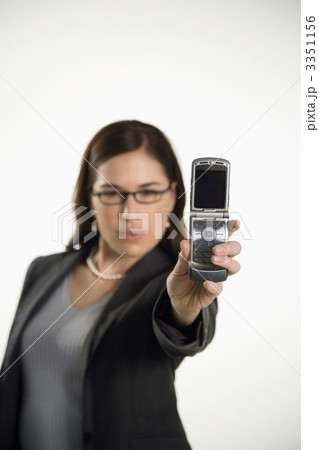 Woman using camera phone. Woman using camera phone. 3351156