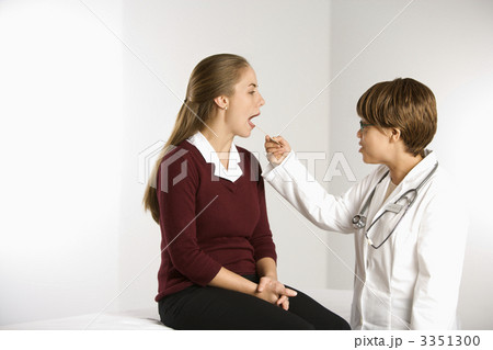 Doctor examining patient. 3351300