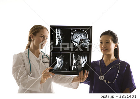 Doctors analyzing x-ray. 3351401