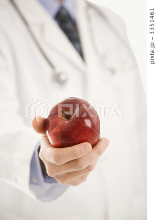 Doctor holding apple. 3351461