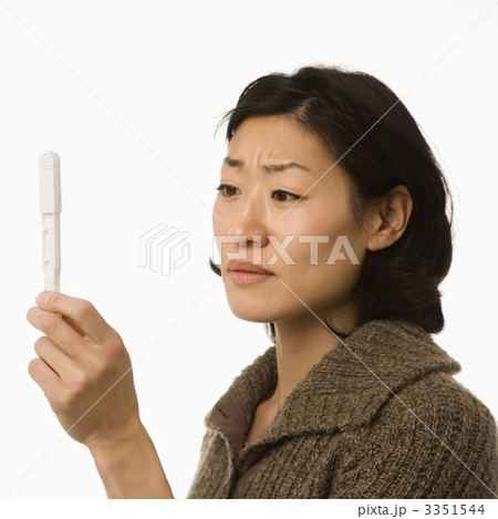 Woman holding pregnancy test. 3351544