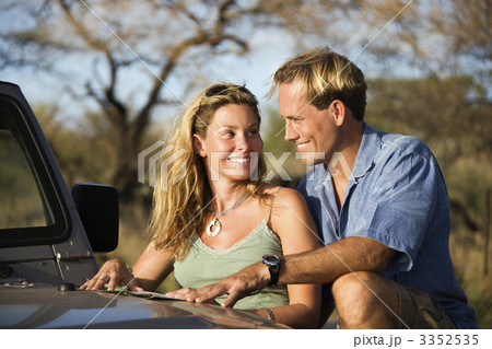 Couple With Map on Car Hood 3352535