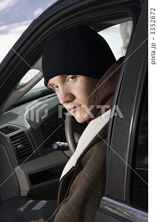 Teenager sitting in car. 3352672