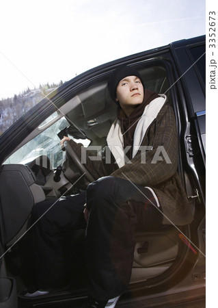 Teenager sitting in car. 3352673