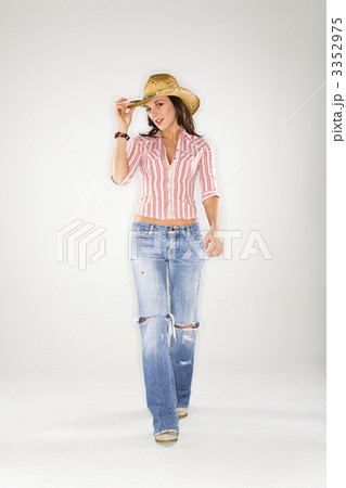 Woman tilting  hat. 3352975