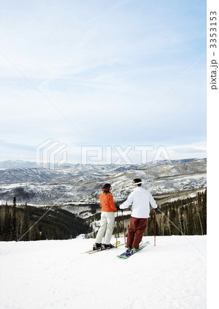 Skiers on Mountain Overlooking Valley Skiers on Mountain Overlooking Valley 3353153
