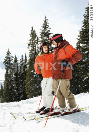 Couple on Skis on Mountain Slope Couple on Skis on Mountain Slope 3353167