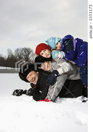 Family stacked in snow. Family stacked in snow. 3353173