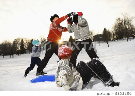 Family playing in snow. 3353206