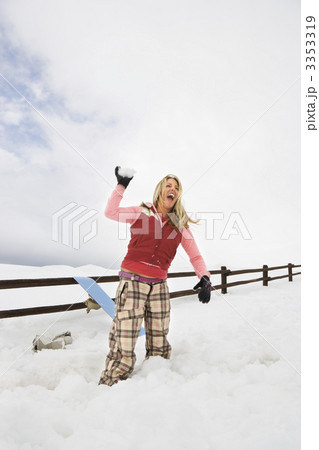 Woman throwing snowball. Woman throwing snowball. 3353319