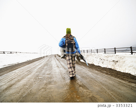 Woman carrying snowboard. Woman carrying snowboard. 3353321