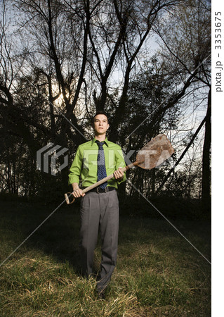 Young Businessman Holding Shovel 3353675