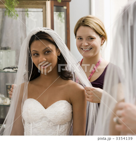 Seamstress helping bride. 3354139