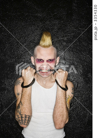 Punk biting handcuffs. 3354330