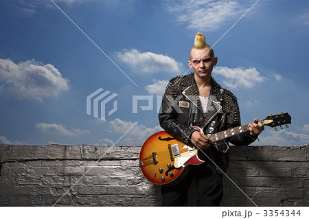 Punk holding guitar. 3354344