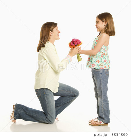 Girl giving mother flowers. 3354360