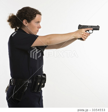 Policewoman aiming gun. 3354553