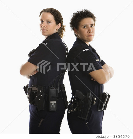 Policewomen back to back. 3354570