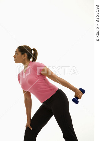 Woman exercising with dumbbell. 3355193