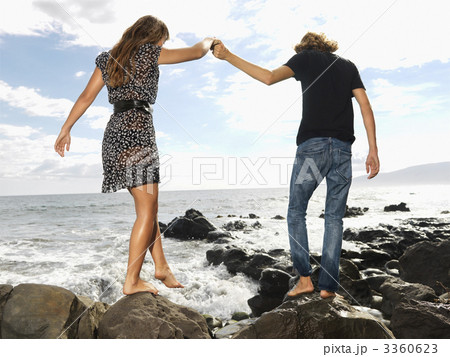 Young Couple Walking at Beach 3360623