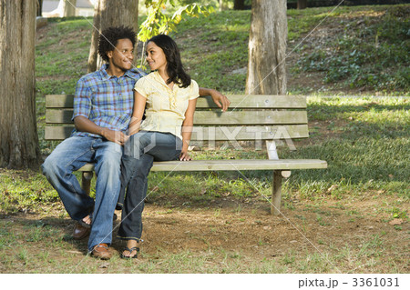 Couple on park bench. Couple on park bench. 3361031