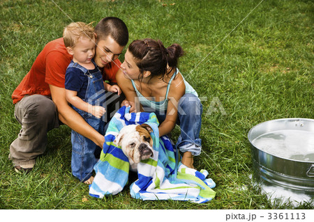 Family giving dog a bath. 3361113