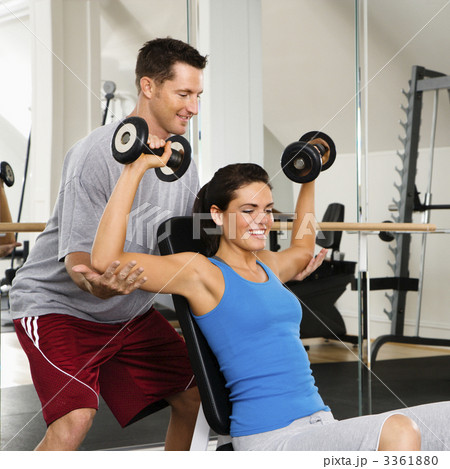 Woman lifting weights 3361880
