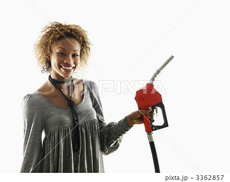 Woman holding fuel pump nozzle 3362857