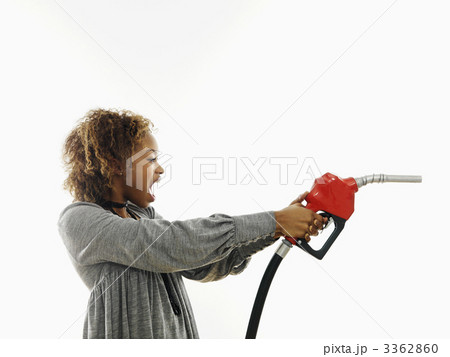 Angry woman with gas nozzle 3362860