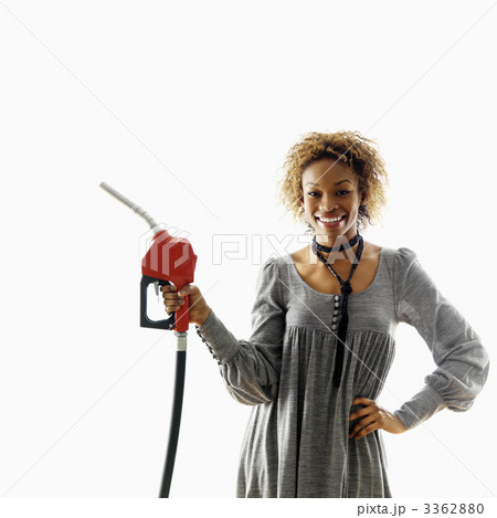 Smiling woman with petro hose 3362880