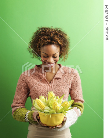 Woman holding corn Woman holding corn 3362904