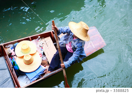 Vendor on traditional floating market in Thailand 3388825