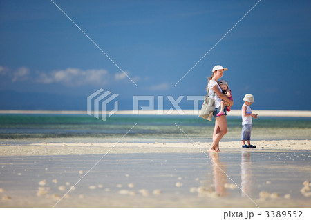 Mother with kids at beach 3389552