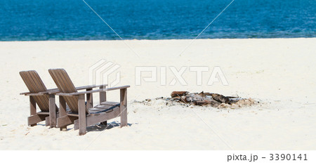 Wooden chairs at tropical beach panorama 3390141