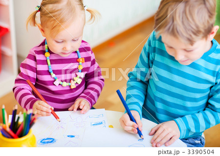 Brother and sister drawing in their room Brother and sister drawing in their room 3390504