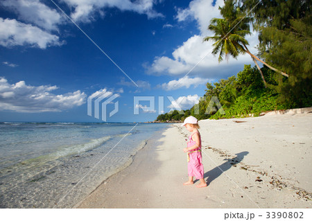 Little girl on tropical beach 3390802