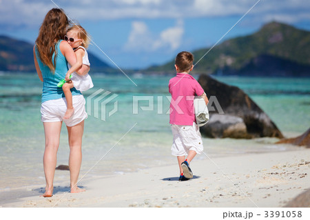 Mother with kids on beach vacation Mother with kids on beach vacation 3391058