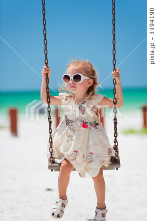 Little girl swinging 3394190