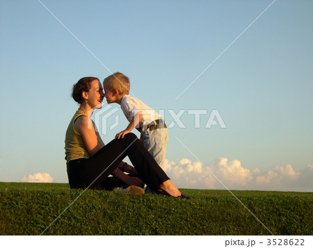 mother with son on sundown kiss by nose mother with son on sundown kiss by nose 3528622
