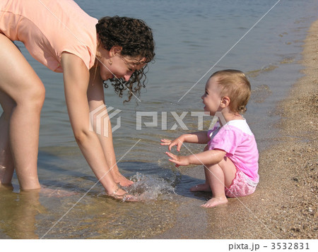 mother with baby on beach 3532831
