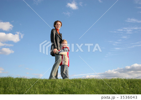 mother with son on grass mother with son on grass 3536043