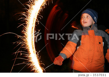 child with moving sparkler 3537031