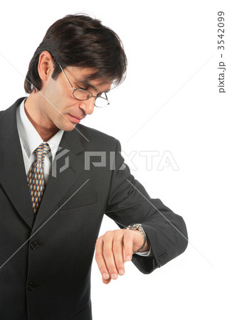 businessman looks at watch 3542099