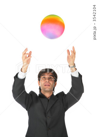 Businessman catches multicolor ball Businessman catches multicolor ball 3542104