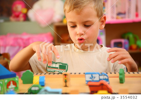 Boy plays in playroom Boy plays in playroom 3554032