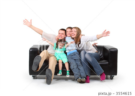 Happy family on black leather sofa 3554615