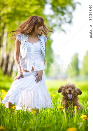 Young woman with cocker spaniel dog 3556346